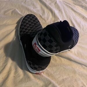 Vans men’s  Black Checkered Slip-On Sneakers